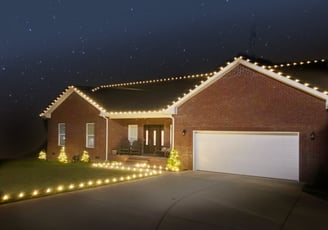 Angled view of home with Christmas lights installed