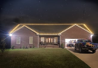 Frontal view of house decorated with lights