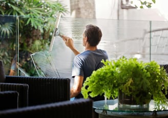 a man cleaning a window