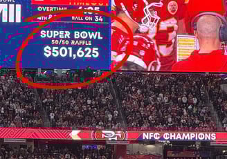 a football player is shown on a large screen