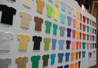 a large display of a variety of different colored shirts