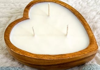a heart shaped wooden candle 