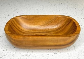 a candle wooden bowl with a wooden bowl on it