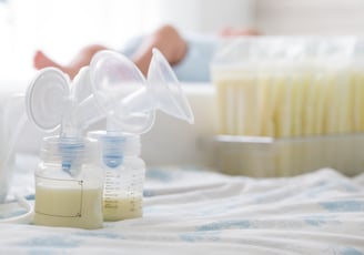 a baby bottle with a bottle of milk and a bottle of milk