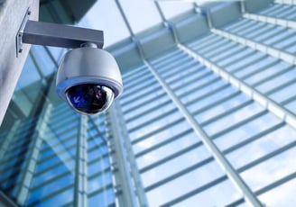 a camera mounted on a pole with a camera attached to it