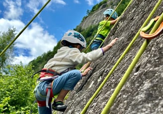 Kids experiencing rock climbing in Sasso Remenno area.