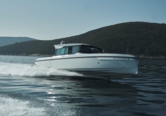 Speedboat floating on the water in full speed.