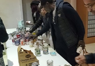 Residents of the Hotel Cecil picking up food at our food bank