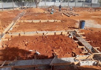 a construction site with a lot of concrete blocks