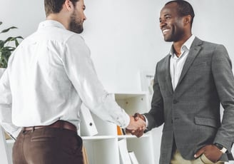 two gentle man shaking hands