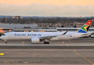 a plane is sitting on the runway at the airport