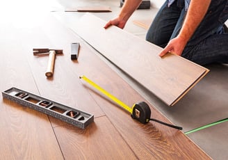 Hardwood floors installer working on new floors