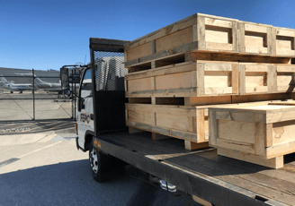 a truck with a load of pallets on it