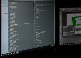 a computer monitor screen showing a computer screen with a computer monitor and a laptop