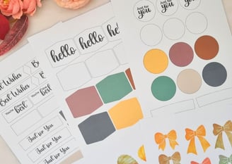 Card making cutouts sheets with messages like "hello" and "Best Wishes" in various shapes