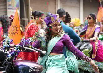 woman in maharastrian traditional outfit riding a motorbike in girgaon gudipadwa shobhayatra 2025