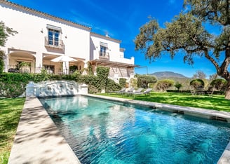 A beautiful pool surrounded by oak trees at Finca Santa Katerina