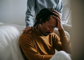 man grieving a loved one by cancer