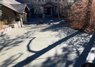 concrete contractors working on a concrete driveway in lakewood, co