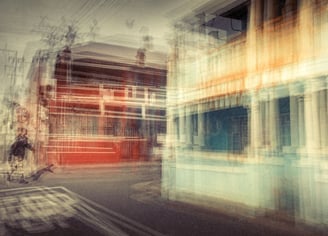 Abstract photograph of a man crossing a colourful Woodstock street, Cape Town, layered exposures blending bright colours