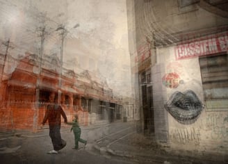 Abstract layered street scene in Cape Town showing a woman and child walking past red buildings and graffiti lips mural.
