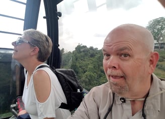 Lady and The Pirate ride the cable car to Sentosa Island in Singapore