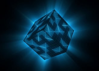 a blue and black cube shaped object with a glowing blue light