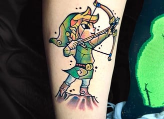 A cartoonish traditional tattoo about Link the legend of Zelda