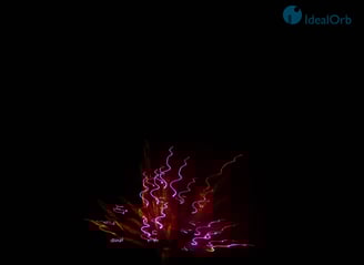 Beautiful firework display of red, pink and orange colors
