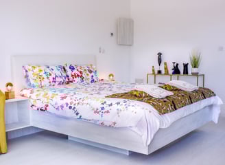 Bedroom with king size bed, air conditioner, built-in bathroom and television at Domaine Des Lucques
