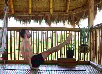 V-Sit on Yoga Mat in Nipa Hut