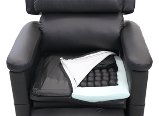 A riser recliner in black wipe clean fabric that can have any seat cushion embedded in it