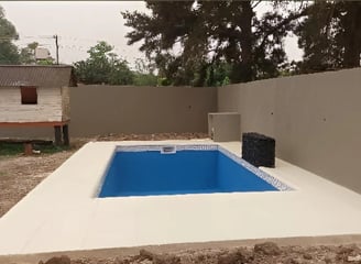 a pool with a blue pool in the middle of the pool