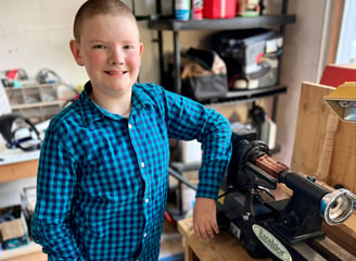 Jackson with his new lathe in his workshop