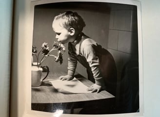 a young boy is shown in this black and white photo