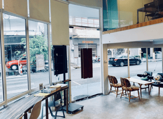 a room with a table and chairs and a television