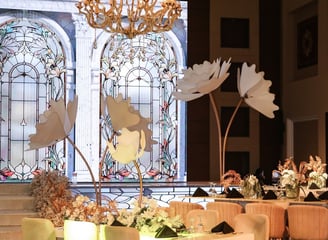 a large table in the front with a led screen in the back of an arches and stained glass