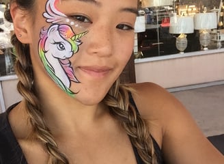 Caroline with a Unicorn Face Painting at a Las Vegas Event