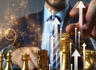 a man in a suit and tie is holding a chess piece, a picture demonstrating business strategy