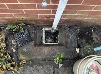 A blocked gully before being unblocked.