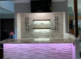 a new kitchen counter top with a bar top bar