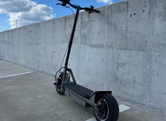 Custom-built electric scooter with 3000W motor, VESC control, and efficient lithium ion battey.