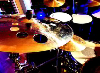 a drum kit with a drum set up in a recording studio