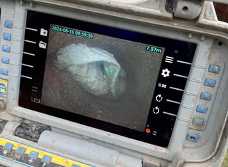 Plastic Carrier Bags Blocking the inside of a drain in Warrington