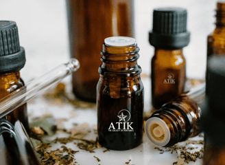 a variety of bottles of atik fragrance oils