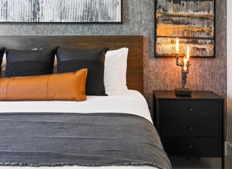 Elegant gray wallpaper accent wall in a modern bedroom, adding texture and sophistication to the space