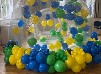 Bubble house with balloon garland set up in tunbridge wells 