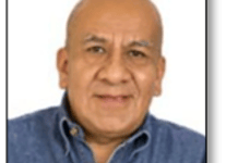 a man in a blue shirt and a white shirt
