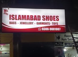 a sign for a shoe shop in a store