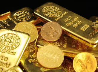 a pile of gold bars with coins and coins